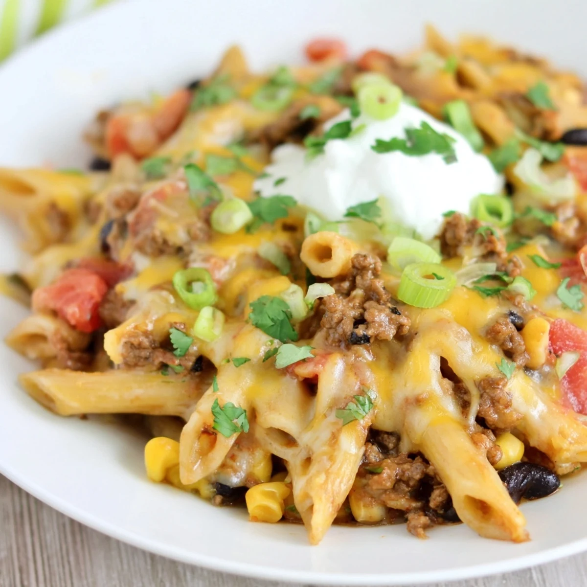 Sizzling Cheesy Taco Pasta, with melted cheese and tender pasta, a flavorful Tex-Mex delight.