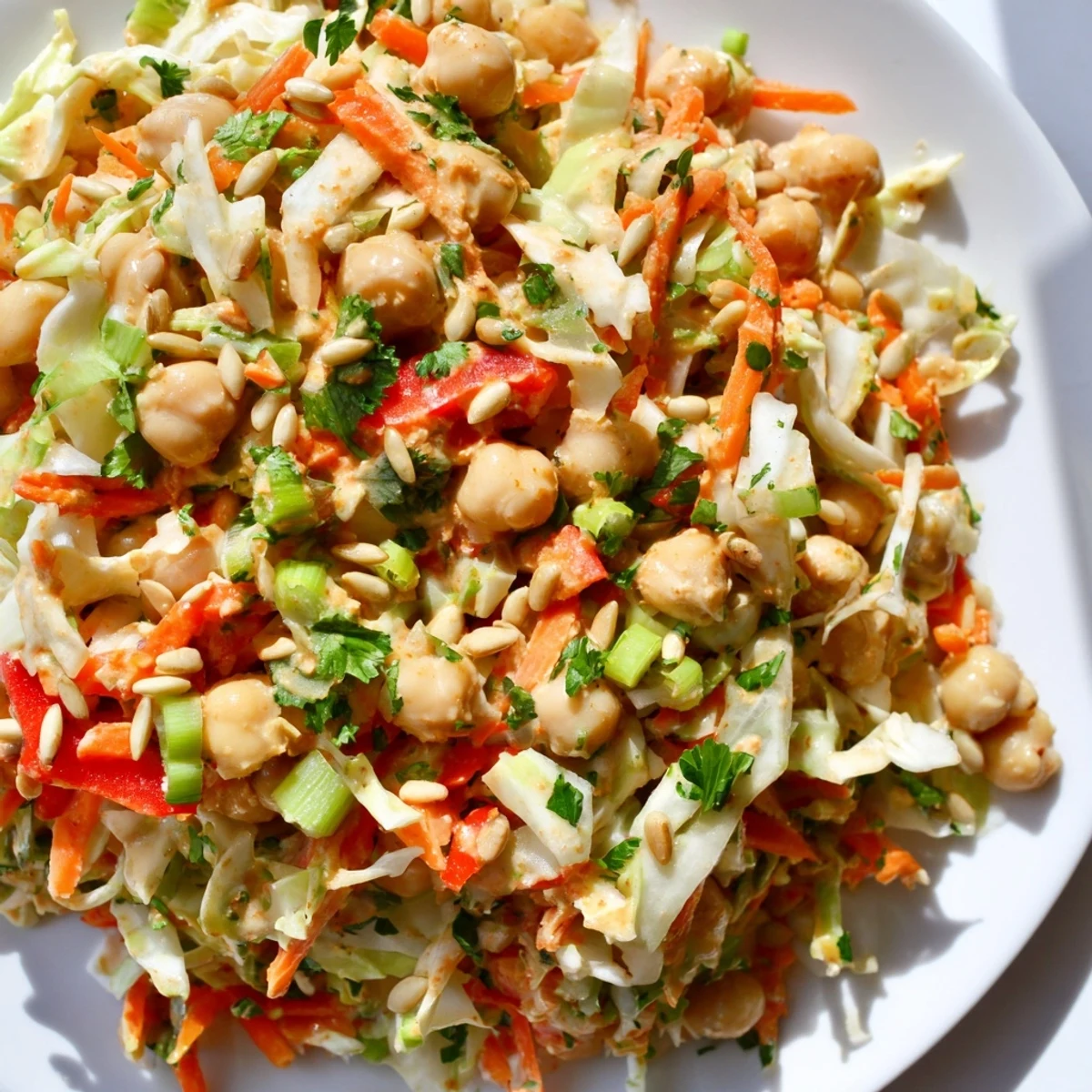 A fresh and flavorful Fiber-Forward Chickpea Salad, with crunchy cabbage and carrots, ready to enjoy.