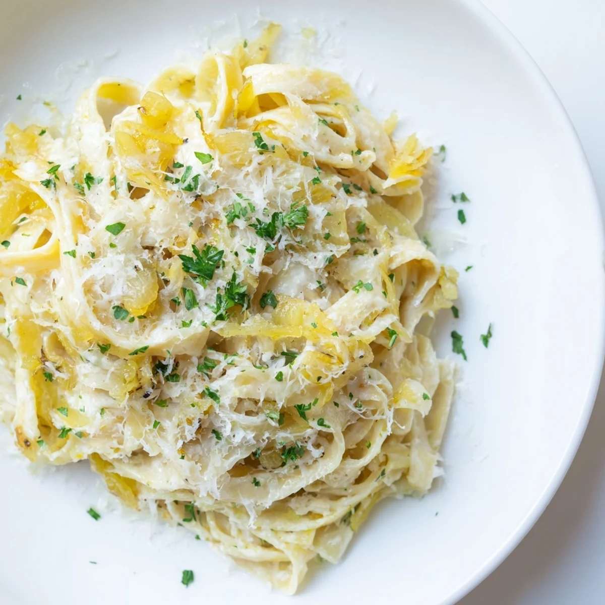 Close-up of the delicious One-Pot French Onion Pasta, steaming and filled with cheesy goodness.