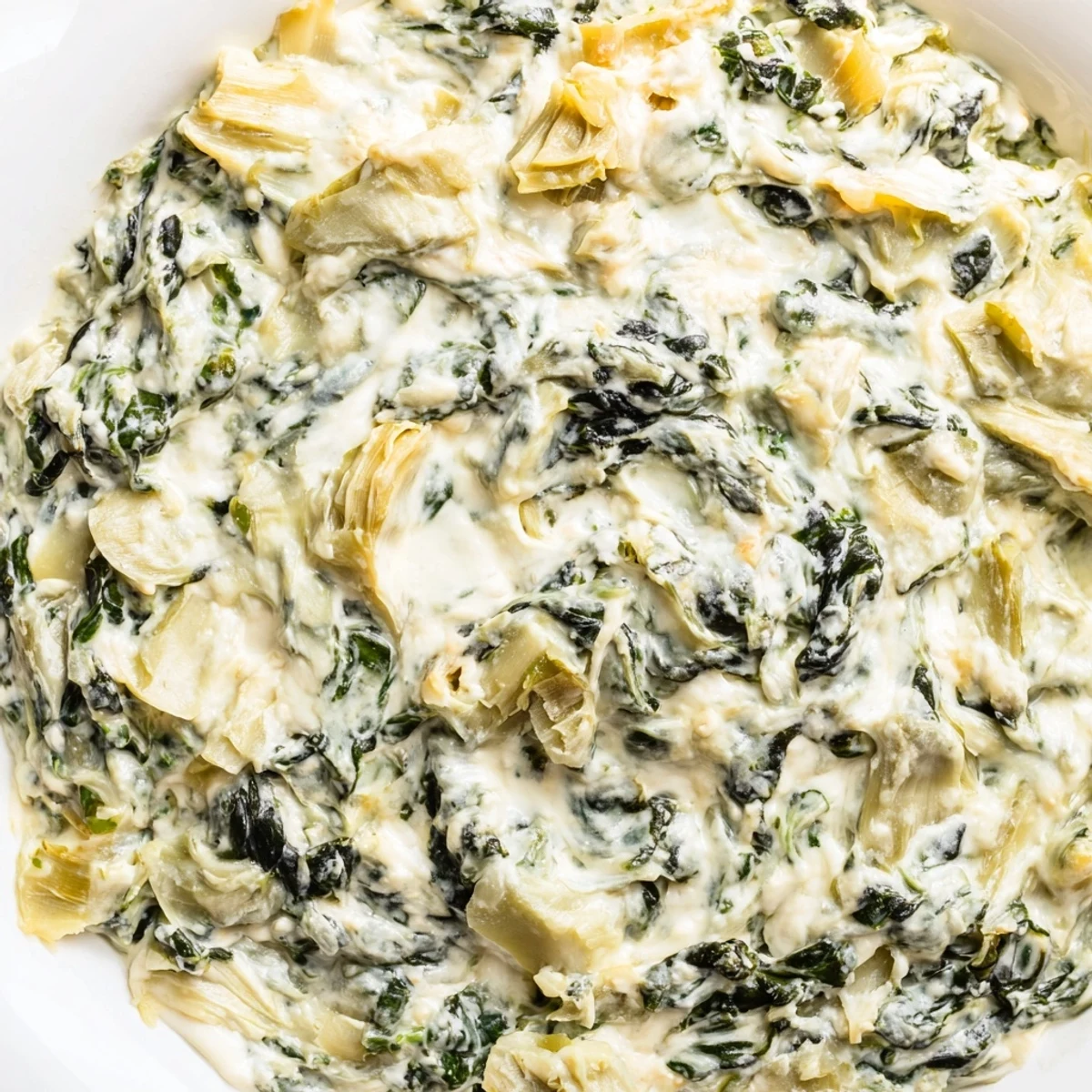 Warm, creamy Spinach Artichoke Dip, a comforting appetizer with melty cheese and tender artichokes.