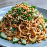 Vivid bowl showcasing delicious Cold Peanut Sesame Noodles, ready to be enjoyed.
