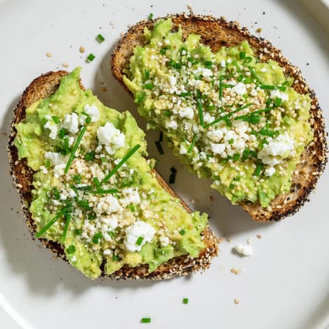 Freshly made avocado toast with everything, a quick breakfast, visually stunning and offering a delicious bite.
