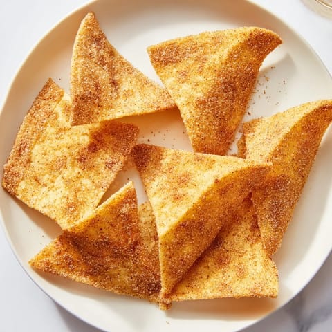 Close-up of freshly air fried cinnamon sugar tortilla chips, ready to enjoy.