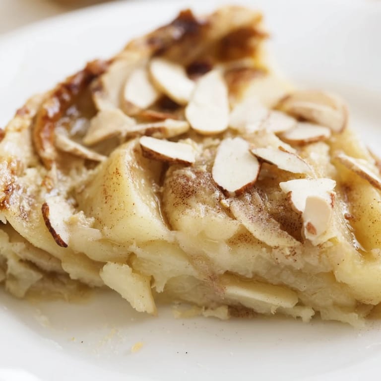 Homemade Rustic Crustless Apple Pie, ready to serve, features glistening, baked apple slices.